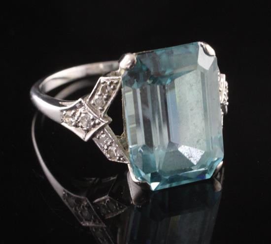 A mid 20th century 18ct white gold, blue topaz? and diamond dress ring, size O.
